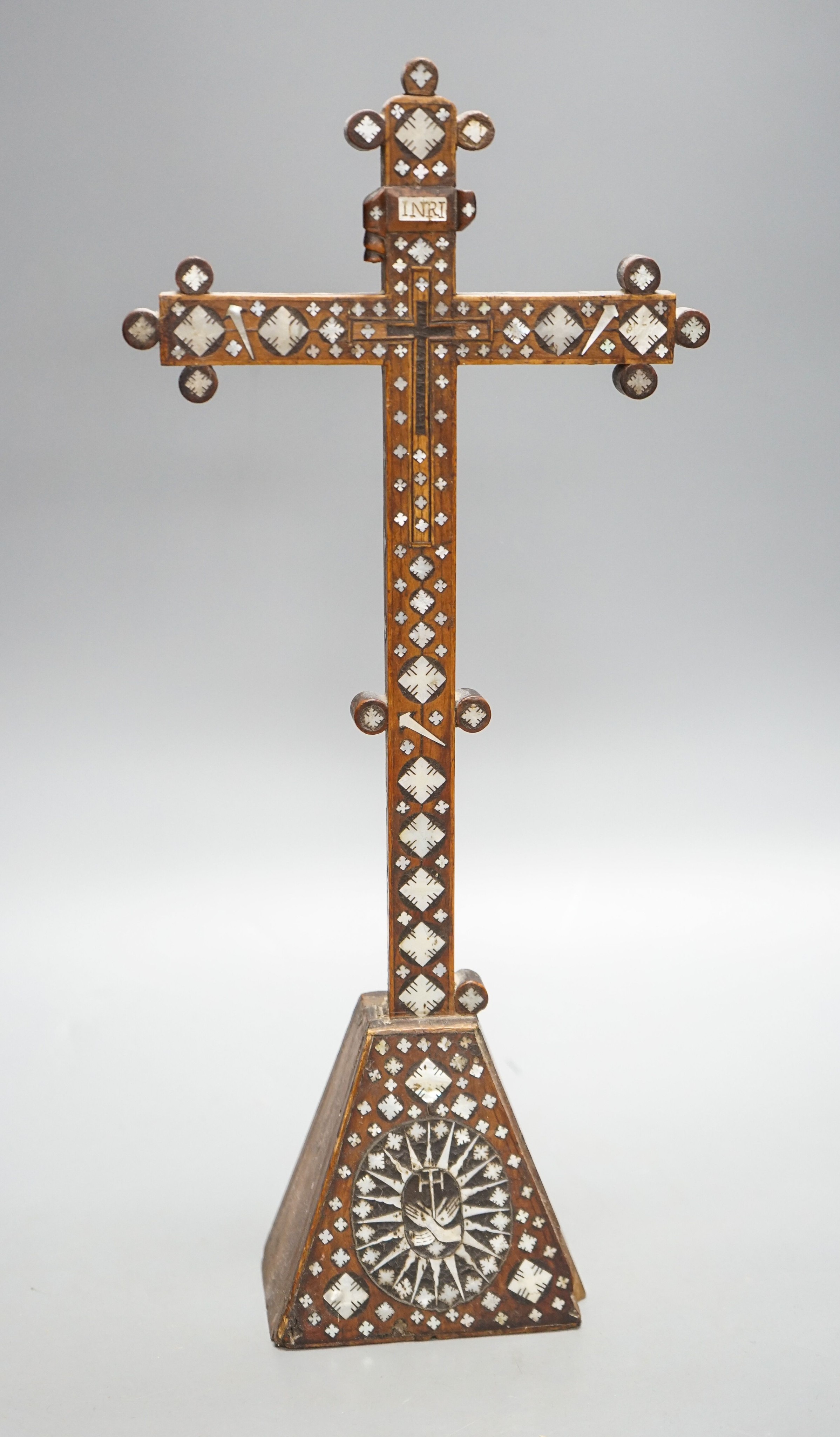 A 19th century Continental fruitwood crucifix with mother of pearl inlay, H 36cm